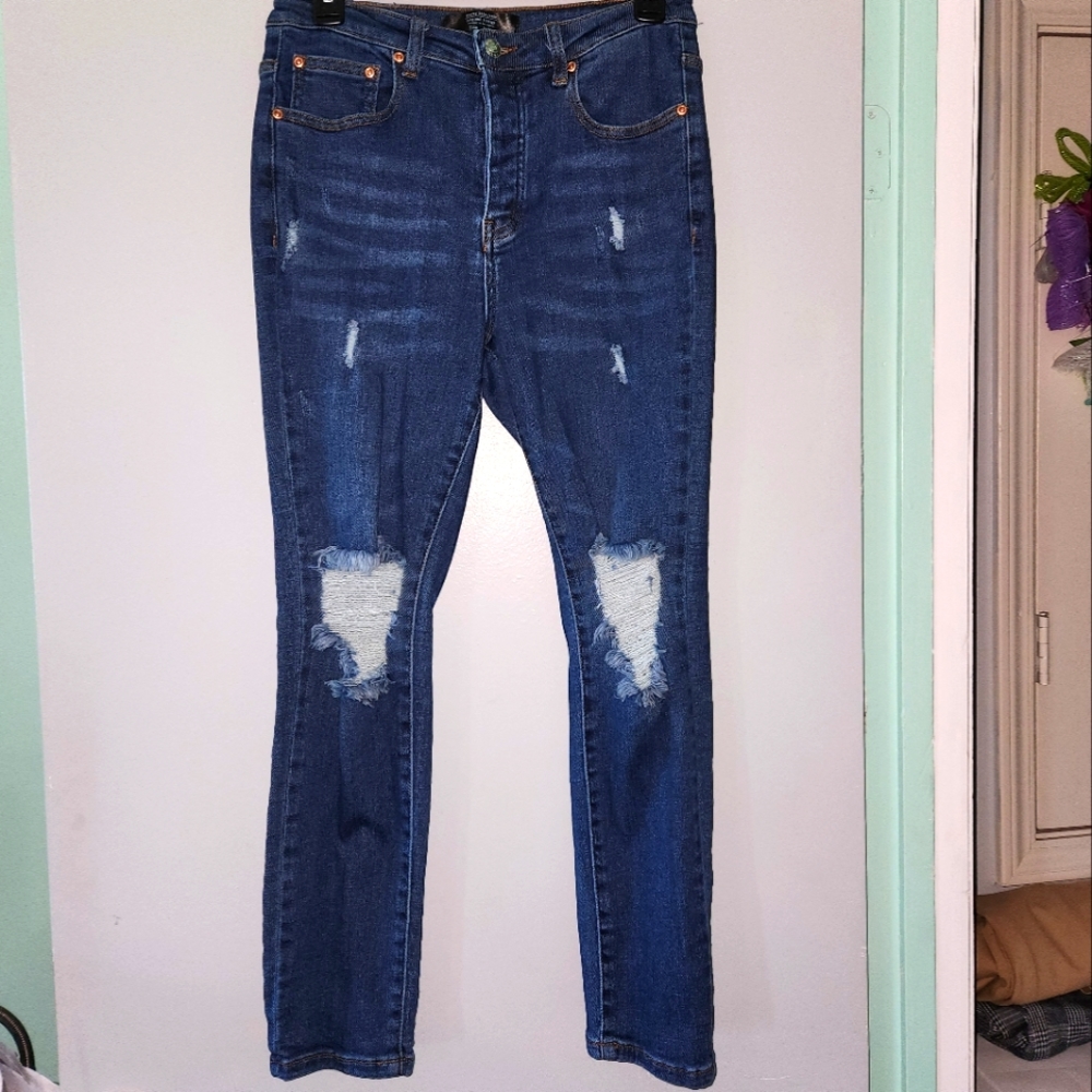 Button fly distressed stretch jeans